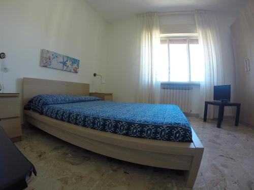Postel nebo postele na pokoji v ubytování Bed and Breakfast Luna Chiara