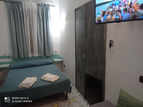 Ένα ή περισσότερα κρεβάτια σε δωμάτιο στο Casa Vacanze Central Cincotta