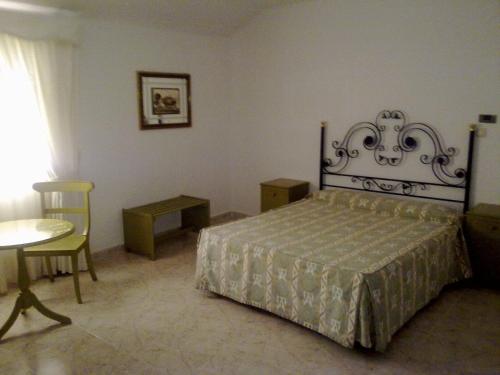 Un pat sau paturi într-o cameră la Arcojalon