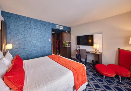 Ένα ή περισσότερα κρεβάτια σε δωμάτιο στο Mercure Chartres Centre Cathedrale
