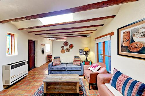 a living room with a couch and a table at Casa De Lorena in Santa Fe