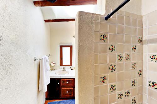 a bathroom with a shower and a sink at Casa De Lorena in Santa Fe