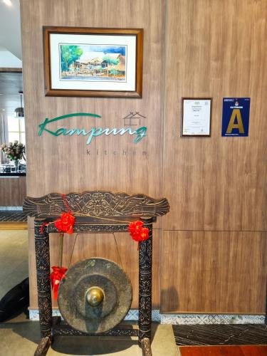 a room with a sign on a wooden wall at ibis Kuala Lumpur City Centre in Kuala Lumpur