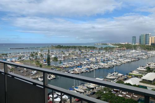 a marina with a bunch of boats in the water at Ilikai Hotel in Honolulu