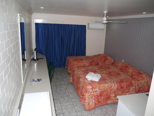 Postel nebo postele na pokoji v ubytování Emu Park Motel
