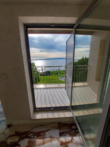 a balcony with a view of the ocean at Art Complex Anel in Sozopol