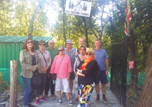 a group of people posing for a picture at a zoo at Dev Bhoomi Farms & Cottages in Dharamshala