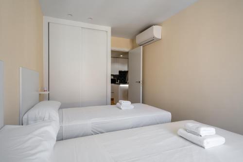 Giường trong phòng chung tại 2 bedrooms 2 bathrooms furnished - Malasaña - bright and refurbished - MintyStay