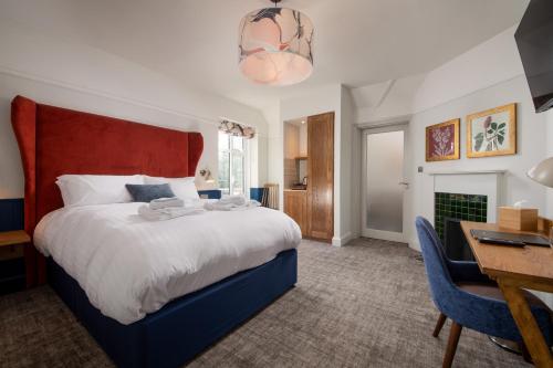 Ένα ή περισσότερα κρεβάτια σε δωμάτιο στο The Chequers Inn