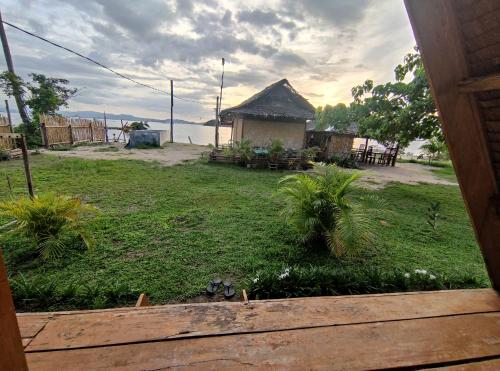a view from a window of a house with a yard at Acuario Beach Inn in San Vicente