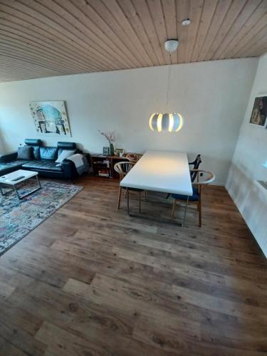 a living room with a table and a couch at "City Sleep" in Nykøbing Mors