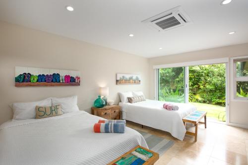 Säng eller sängar i ett rum på Hale Maunalua