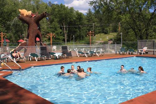 a group of people in a swimming pool at Meadowbrook Resort in Wisconsin Dells