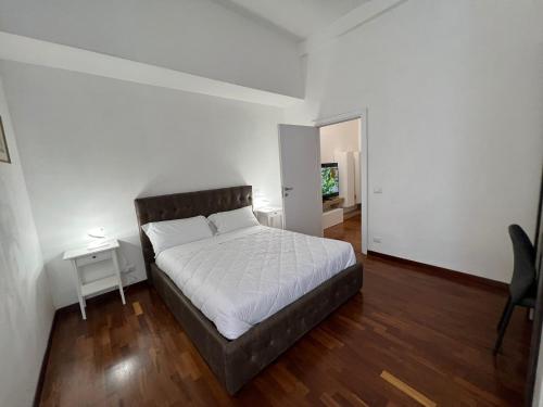 A bed or beds in a room at StarHome Colosseo