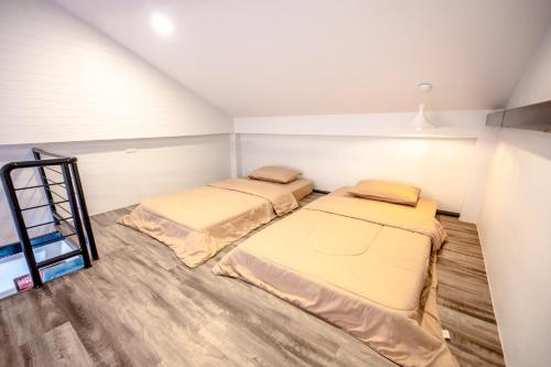 Ein Bett oder Betten in einem Zimmer der Unterkunft บ้านสุขซอย5