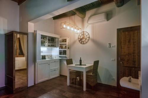 a kitchen with a table and a dining room at Oro Nero Florence in Florence
