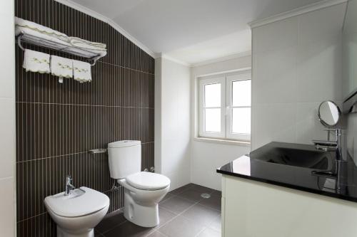 Ванная комната в Santa Justa Suites by Homing