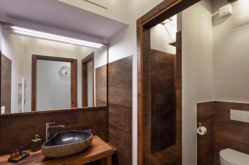 a bathroom with a sink and a mirror at Oro Nero Florence in Florence