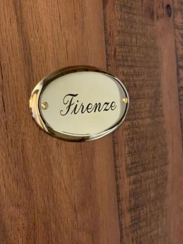 a metal door handle with the word firestone on it at Oro Nero Florence in Florence