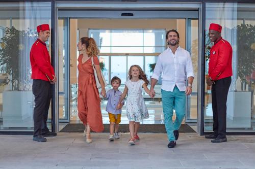 a group of people walking out of a building at Bahia Principe Fantasia Tenerife - All Inclusive in San Miguel de Abona