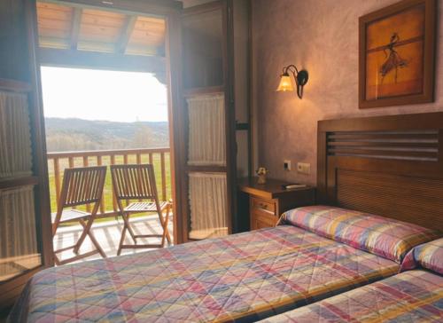 Un pat sau paturi într-o cameră la Hotel Rural El Verdenal