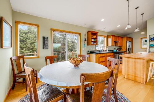 a kitchen and dining room with a table and chairs at Escape to the Cape in Tillamook