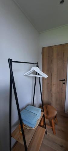 a room with a swing with blue pillows on it at La vache au lit in Damme