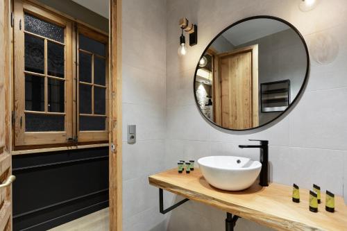 a bathroom with a sink and a mirror at Sagrada266 by chicStays in Barcelona