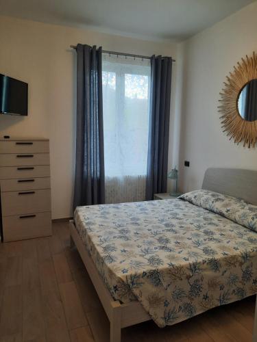 Кровать или кровати в номере Appartamento Blu