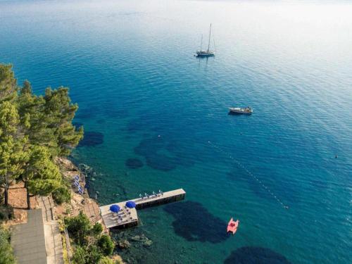 an aerial view of a large body of water with a boat at Albergo Filippo II in Porto Santo Stefano