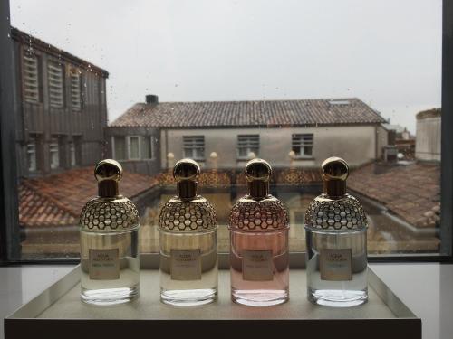 three bottles of alcohol sitting on a window sill at InterContinental Bordeaux Le Grand Hotel by IHG in Bordeaux
