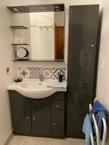 a bathroom with a sink and a mirror at CLOS DE LA FONT in Mollégès