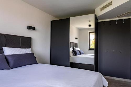 Villa Baden tesisinde bir odada yatak veya yataklar