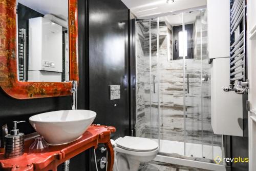 a bathroom with a sink and a toilet and a shower at ML Luxury Apartment in Rome