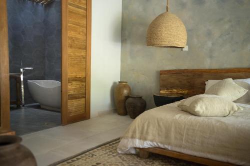 Katil atau katil-katil dalam bilik di Nagara Boutique Hotel