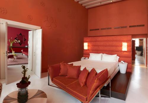 a bedroom with a large bed and a couch at Sina Centurion Palace in Venice
