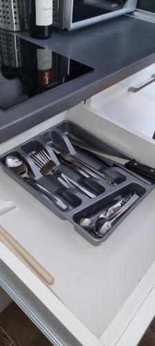 a drawer in a kitchen with utensils in it at Kraljevi Cardaci 9D 12- Sunny view in Kopaonik