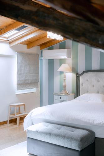 Ένα ή περισσότερα κρεβάτια σε δωμάτιο στο Kastello Hotel
