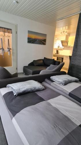 a group of beds in a living room at Ferienwohnung Thore in Emden