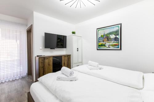 Postel nebo postele na pokoji v ubytování Reset Apartments