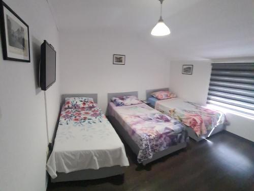 Postel nebo postele na pokoji v ubytování Hostel FM