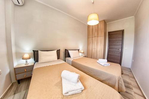 Ένα ή περισσότερα κρεβάτια σε δωμάτιο στο Lydia's Apartments