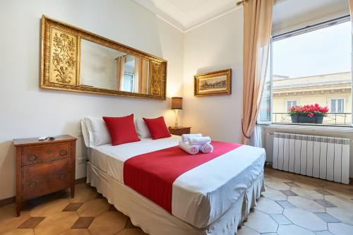 a hotel room with a large bed and a large window at Fabrizio's Rooms in Rome