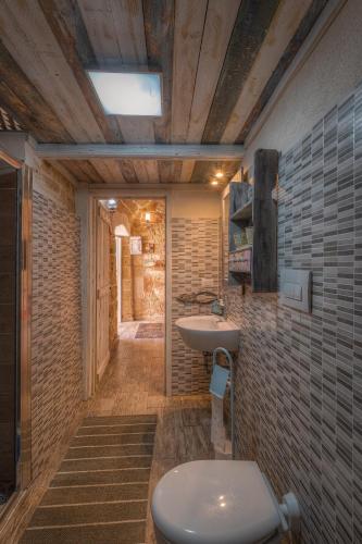 a bathroom with a toilet and a sink at Le casette di Nardò in Nardò