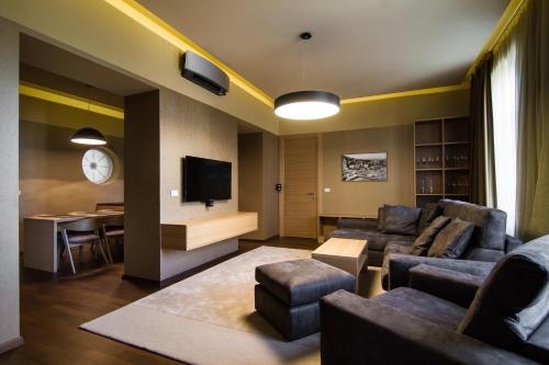 a living room with a couch and a table at Luxury Apartments Centre of Opatija in Opatija