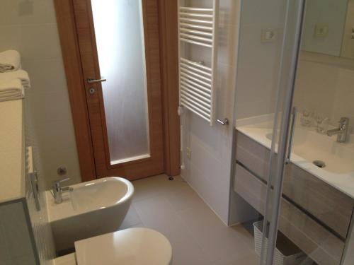 a bathroom with a sink and a toilet and a shower at Luxury Apartments Centre of Opatija in Opatija