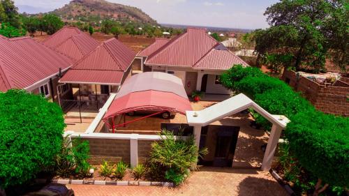 an overhead view of a house with a red roof at Randa Family House - Moshi in Himo