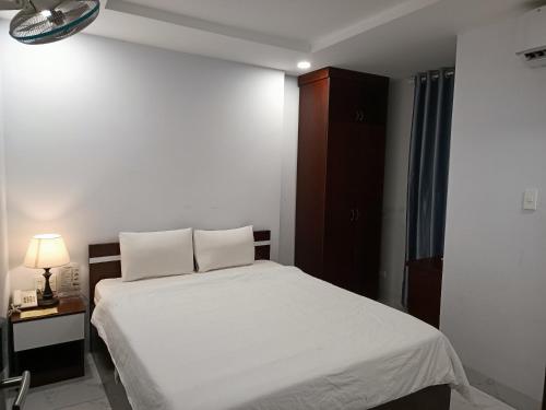 Postel nebo postele na pokoji v ubytování Tân Thi Hotel