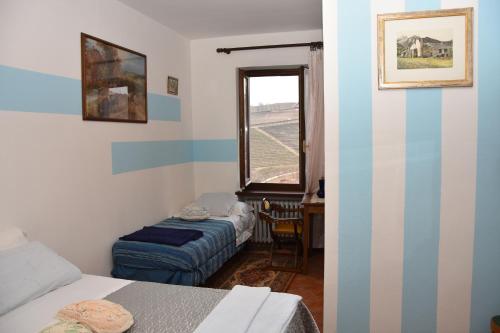 מיטה או מיטות בחדר ב-Agriturismo Maria Cristina
