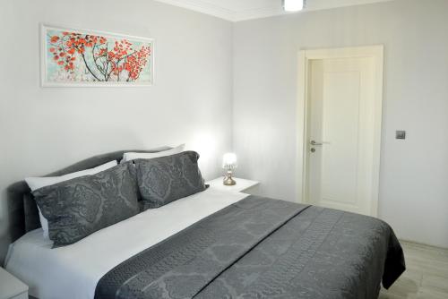 Una cama o camas en una habitación de Melissa Suite Otel